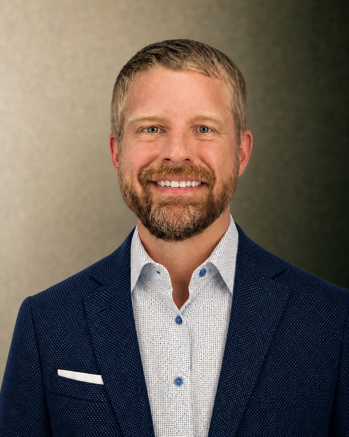 Bryan Burke, smiling in a blue jacket
